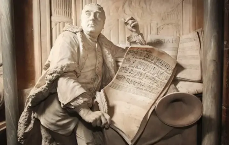 Das Grabdenkmal Georg Friedrich Händels in Westminster Abbey, London. Zu sehen ist der Komponist, wie er ein Notenblatt mit den Worten „I know that my Redeemer liveth“ in den Händen hält.